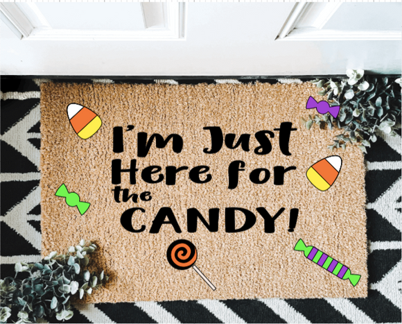 Im just Here for the candy outdoor mat
